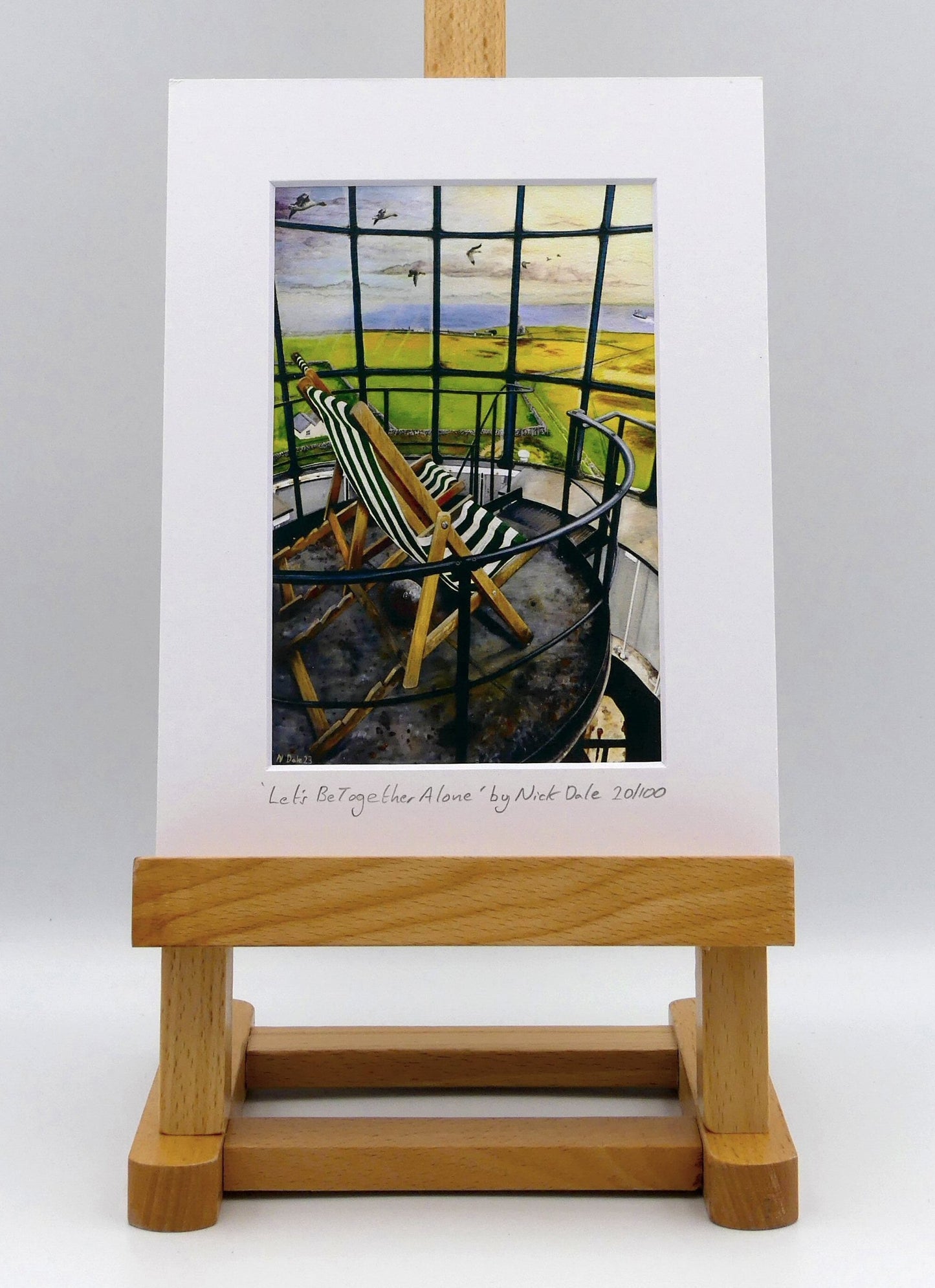 Image of a Small Art Print featuring a copy of the painting 'Let's Be Together Alone' by Nick Dale. The print depicts the view from the lantern room of the Old Light lighthouse on Beacon Hill, on the island of Lundy, Devon. The print is situated on a small easel.