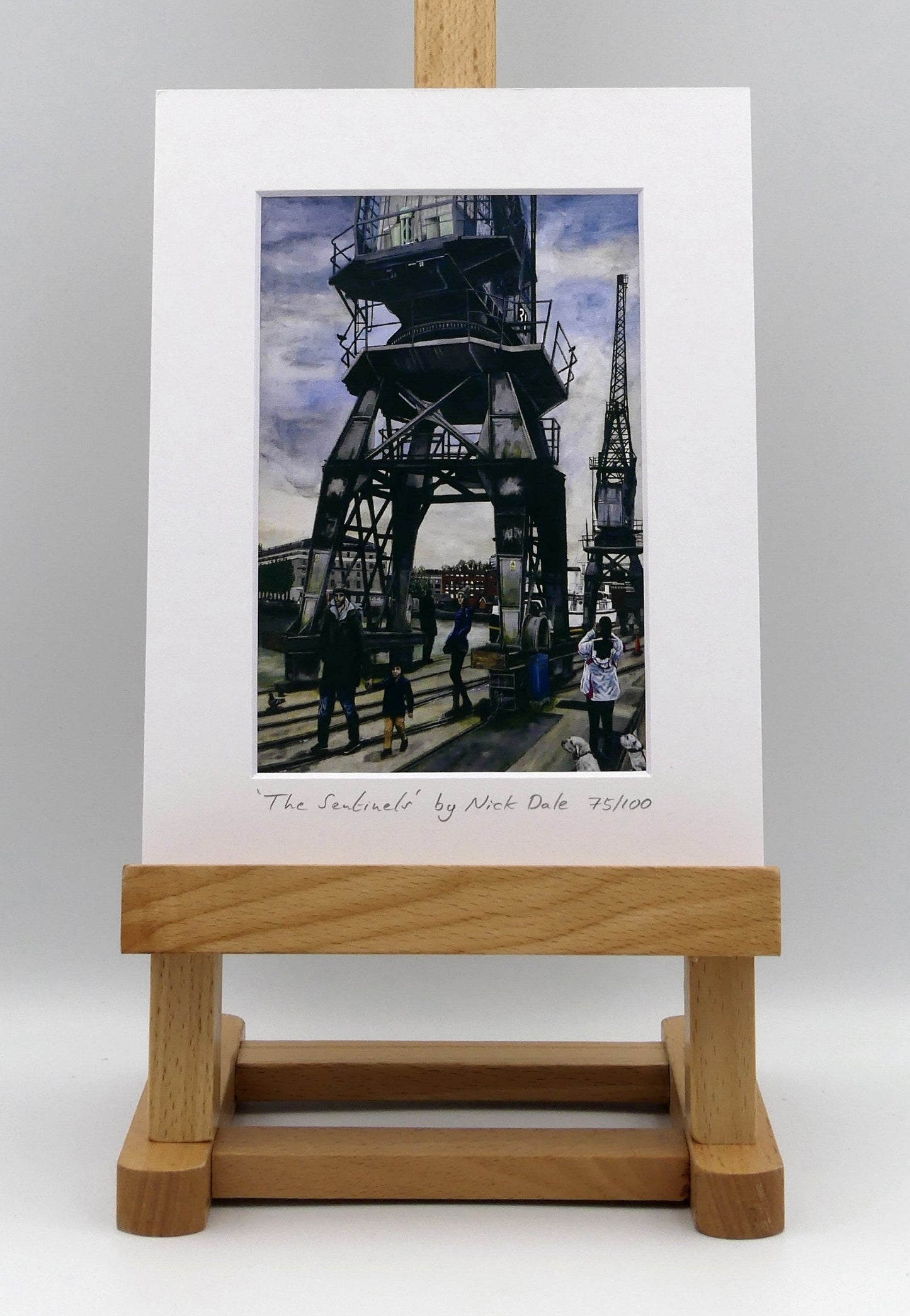 Image of a Small Art Print featuring a copy of the painting 'The Sentinels' by Nick Dale. The print depicts the iconic tower cranes of Bristol Docks and the classic ship MV Balmoral beyond them. The print is situated on a small easel.