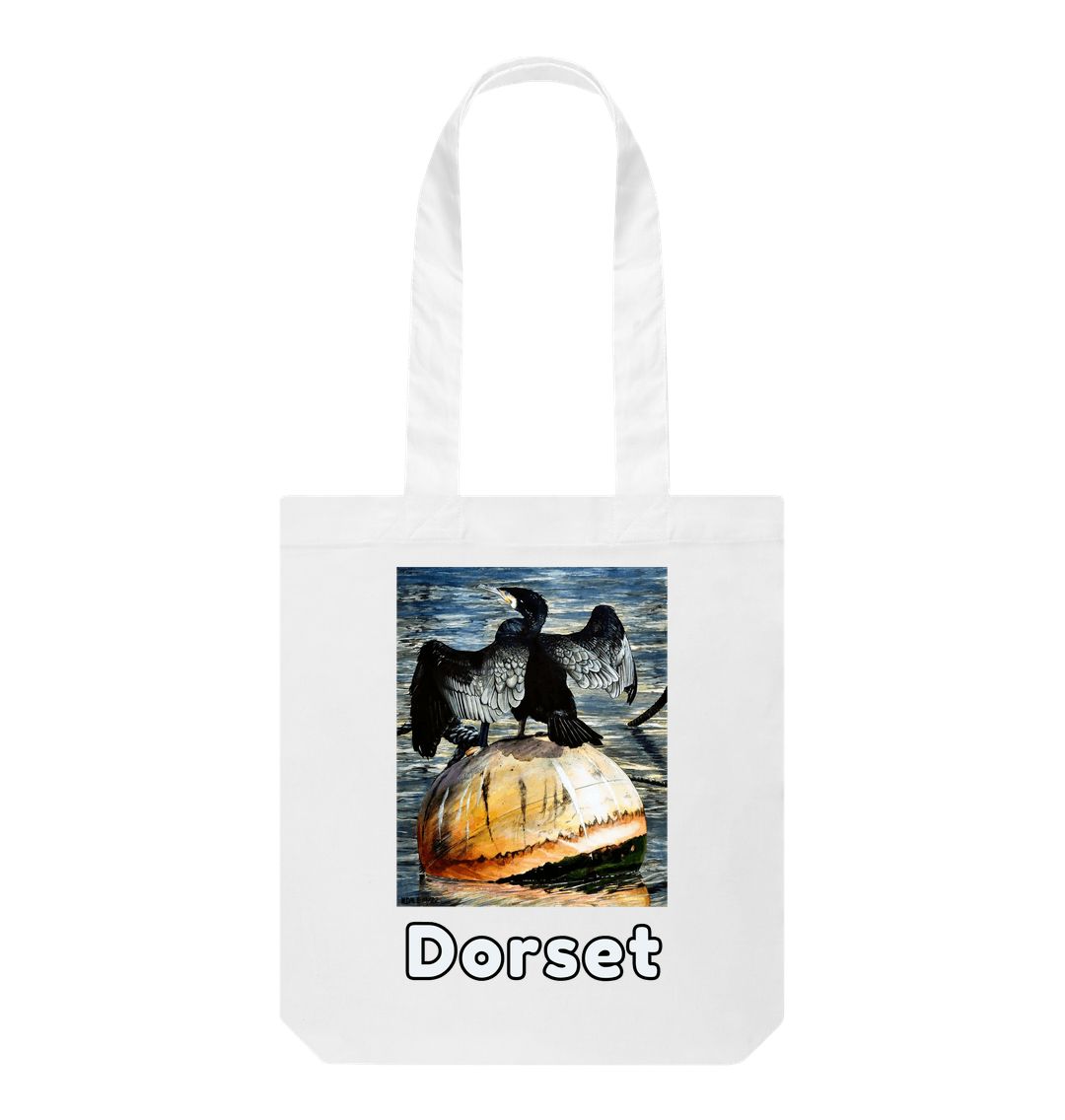 Image of a White Tote Bag featuring a copy of the painting 'Cormorant At West Bay' by Nick Dale. The bag depicts a close-up of a cormorant sunbathing on a mooring buoy in West Bay's harbour in Dorset.