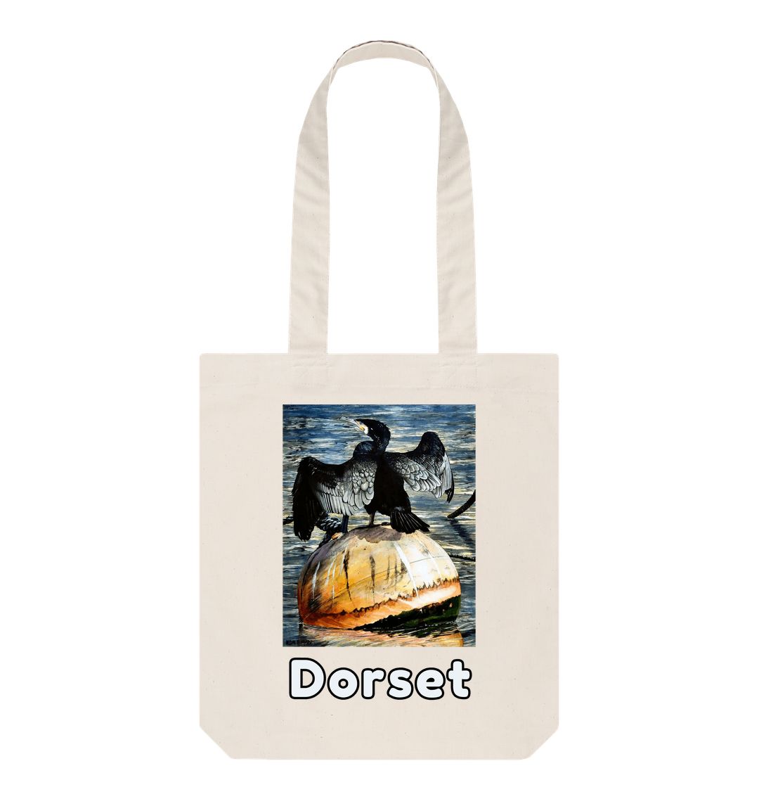 Image of a Natural Tote Bag featuring a copy of the painting 'Cormorant At West Bay' by Nick Dale. The bag depicts a close-up of a cormorant sunbathing on a mooring buoy in West Bay's harbour in Dorset.
