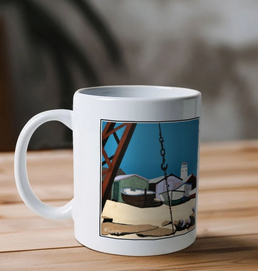 Image of a White Mug on a wooden shelf featuring a copy of the painting 'Old Lower Lighthouse, Portland' by Nick Dale. The handle is orientated to the left. The mug depicts the view from the Red Crane at Portland Bill, across to the Old Lower Lighthouse over the beach huts and small boats next to the stone loading quay.
