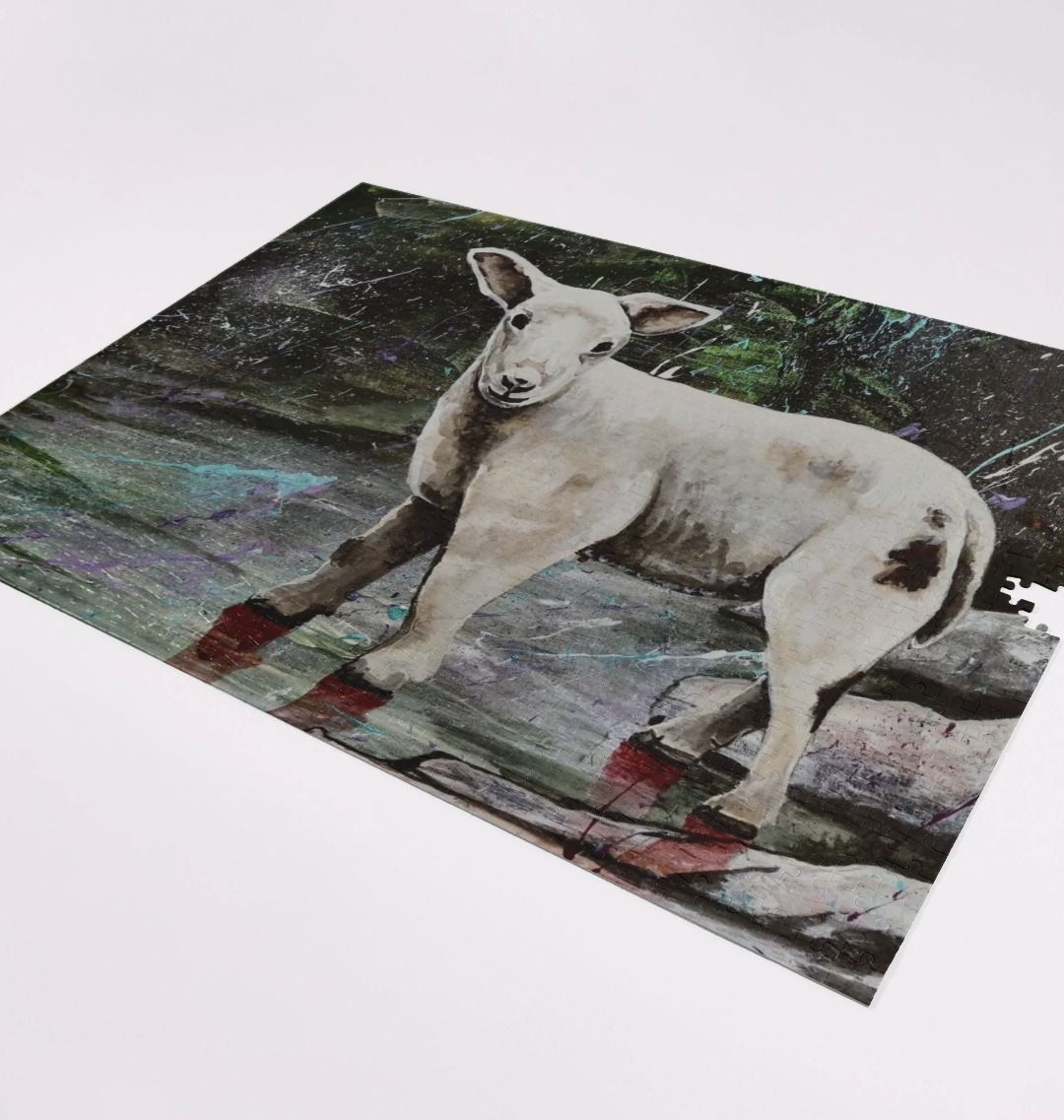 Image of a 1000 Piece Jigsaw Puzzle featuring a copy of the painting 'The Lamb Of Lundy' by Nick Dale. As displayed partially completed on a white surface. The jigsaw depicts a close-up study of a lamb observed on the island of Lundy, Devon.