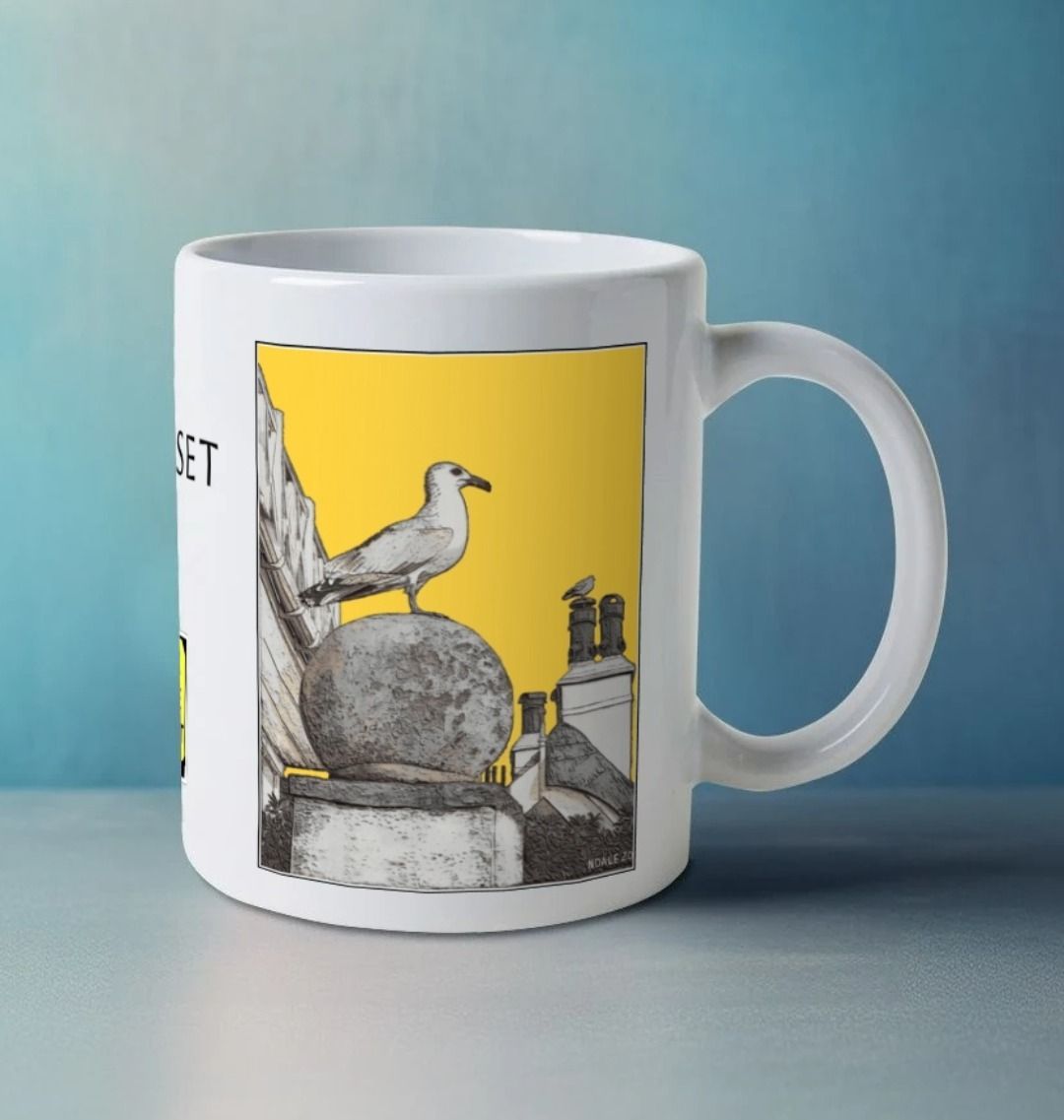 Image of a White Mug on a white table featuring a modified copy of the painting 'A View Of The Sea At Lyme Regis' by Nick Dale - this being the 'Yellow' version. The handle is orientated to the right. The mug depicts a gull and buildings along Marine Parade, Lyme Regis.