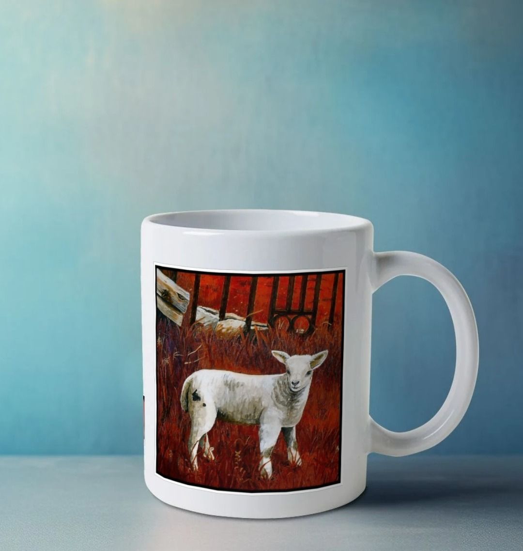Image of a White Mug on a white worksurface featuring a modified copy of a detail from the painting 'The Gate' by Nick Dale. The handle is orientated to the right. The mug depicts a lamb in front of an ornamental garden gate reused by a farmer somewhere in North Devon, probably to the south of Valley of Rocks, Lynton. The lamb was observed on Lundy Island, Devon.