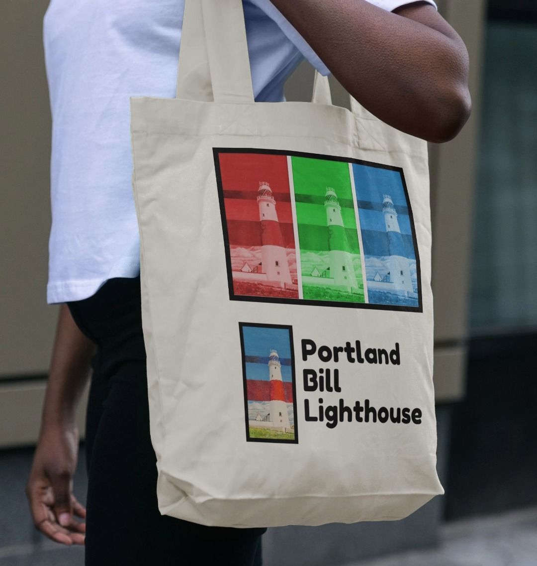 Image of a female model carrying a Natural Tote Bag featuring a copy of the painting 'Rothko's Work Experience At Portland Bill' by Nick Dale, as well as 3 digitally modified versions of the same painting. The words 'Portland Bill Lighthouse' are written in the bottom right corner. The scene imagines what might happen if the abstract painter Mark Rothko worked at Portland Bill Lighthouse in Portland, Dorset.