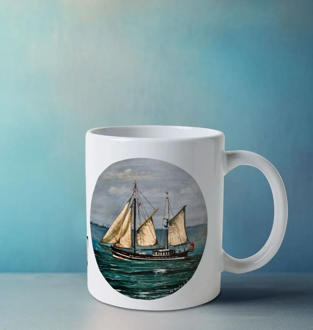 Image of a White Mug on a white surface featuring a copy of the painting 'Moonfleet Sailing Past Portland' by Nick Dale. The handle is orientated to the right. The mug depicts the tall ship Moonfleet sailing past the western coast of Portland, Dorset. As observed from Ringstead Beach.