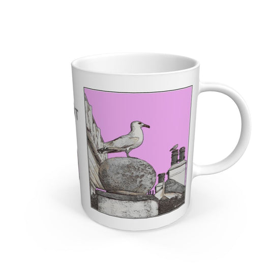 Image of a White Mug featuring a modified copy of the painting 'A View Of The Sea At Lyme Regis' by Nick Dale - this being the 'Pink' version. The mug depicts a gull and buildings along Marine Parade, Lyme Regis.