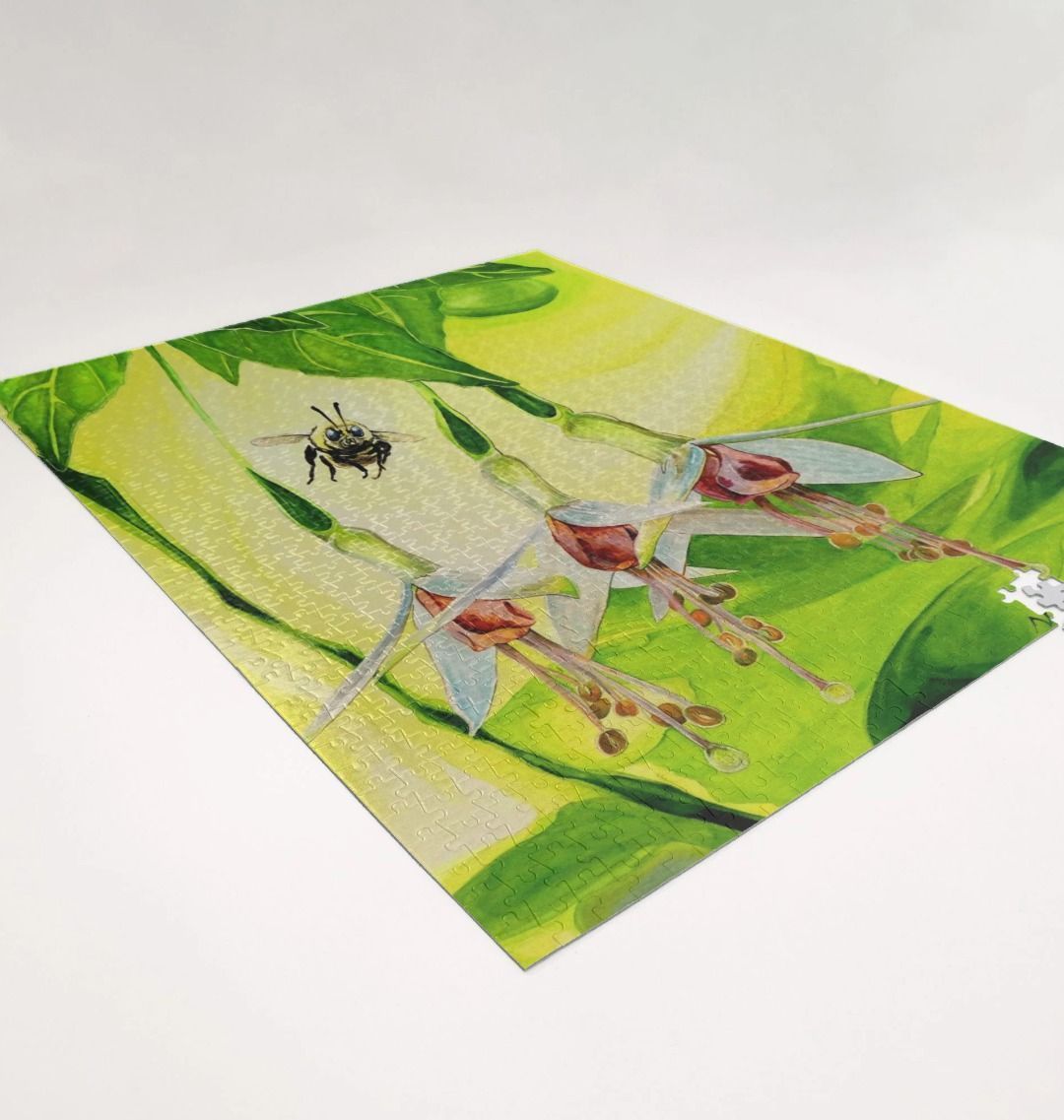 Image of a 1000 Piece Jigsaw Puzzle featuring a copy of the painting 'The Three Muses' by Nick Dale. As displayed partially completed on a white surface. The jigsaw depicts a close-up view of a bee approaching its prize. But which will it choose?