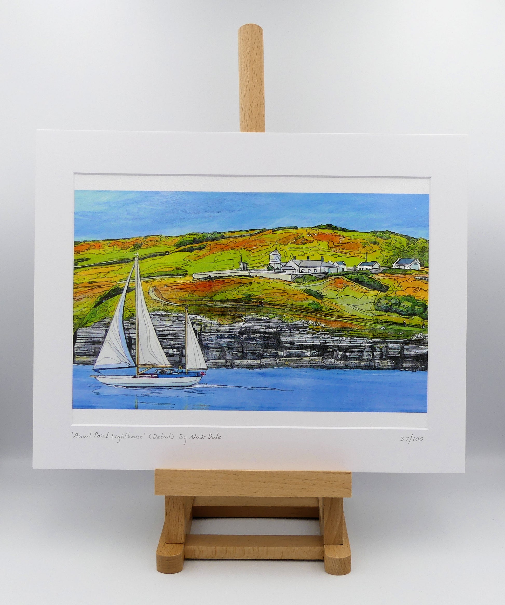 Image of a Medium Art Print featuring a copy of the painting 'Anvil Point Lighthouse' by Nick Dale. The print depicts the part of the original painting showing the Anvil Point Lighthouse at Durlston Country Park, Swanage. Based on the view from the paddle-steamer Waverley. The print is situated on a small easel.
