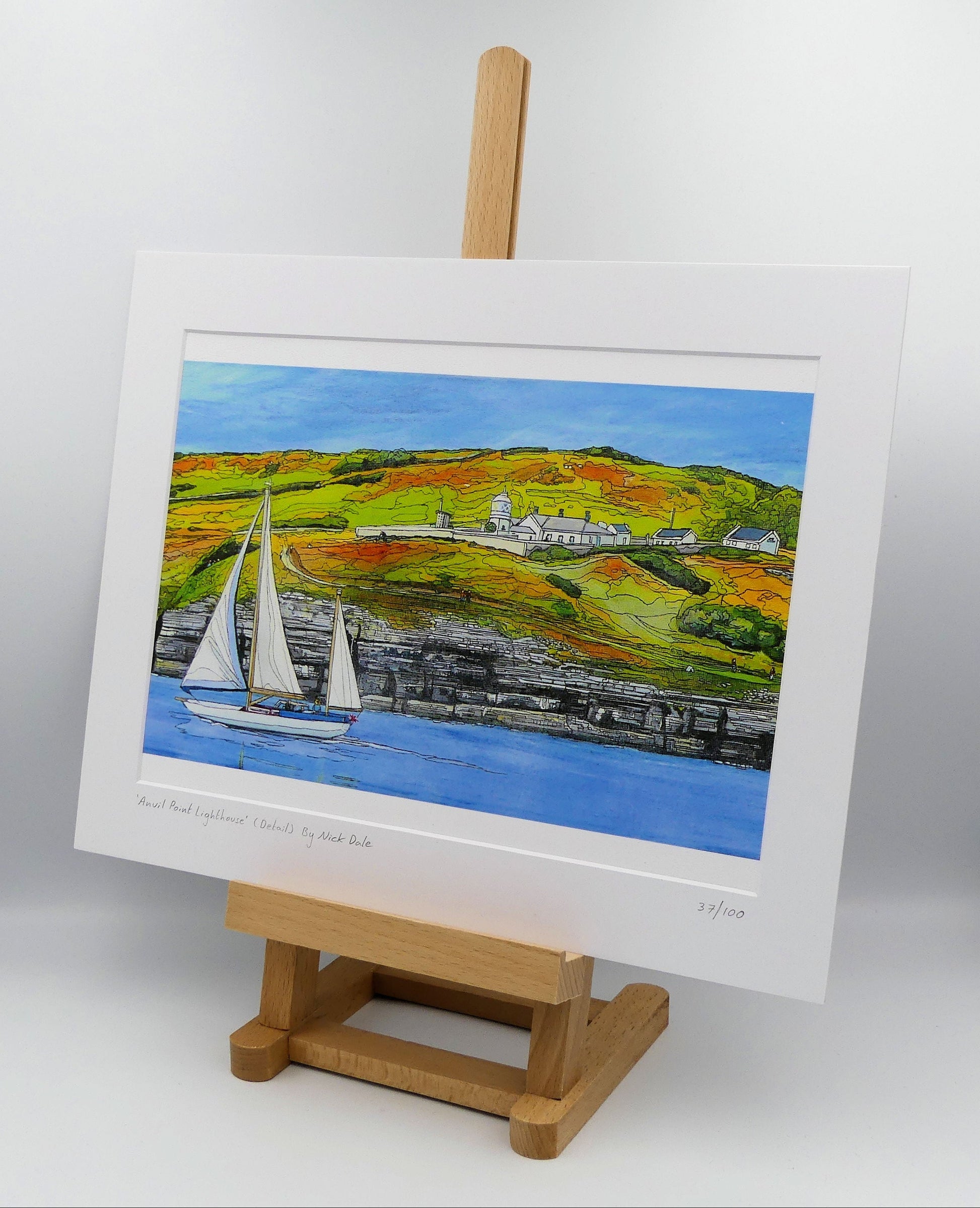 Image of a Medium Art Print featuring a copy of the painting 'Anvil Point Lighthouse' by Nick Dale. The print depicts the part of the original painting showing the Anvil Point Lighthouse at Durlston Country Park, Swanage. Based on the view from the paddle-steamer Waverley. The print is situated on a small easel.