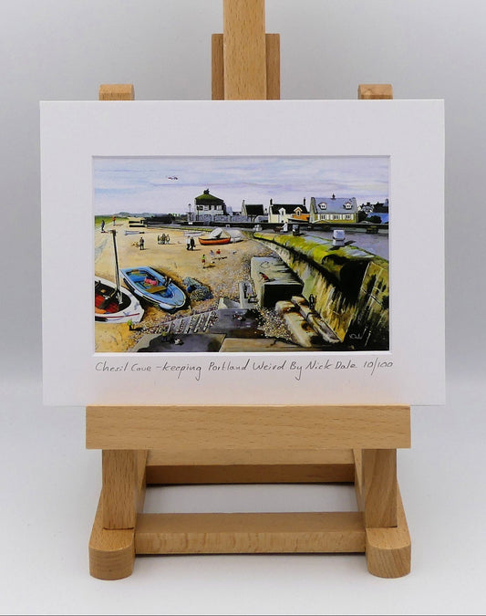 Image of a Small Art Print featuring a copy of the painting 'Chesil Cove - Keeping Portland Weird' by Nick Dale. The print depicts the end of Chesil Beach where it meets Portland at Chesil Cove. In the scene the size of the people is not affected by their distance from the foreground, hence making their appearance slightly surreal.  The print is situated on a small easel.