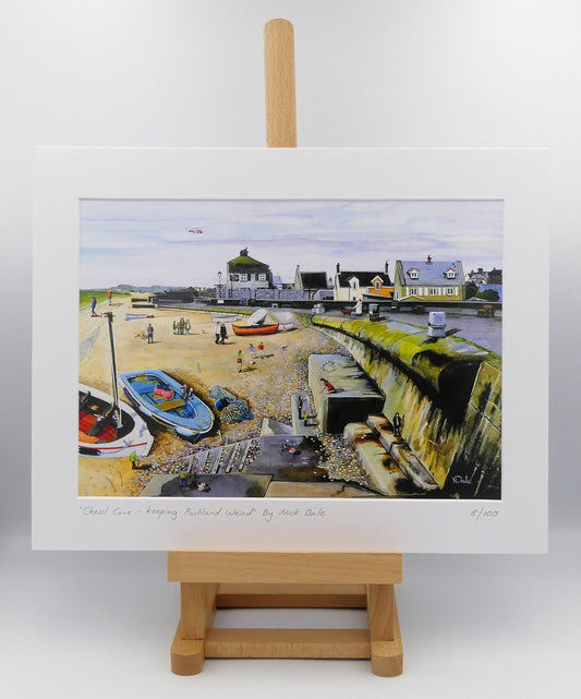 Image of a Medium Art Print featuring a copy of the painting 'Chesil Cove - Keeping Portland Weird' by Nick Dale. The print depicts the end of Chesil Beach where it meets Portland at Chesil Cove. In the scene the size of the people is not affected by their distance from the foreground, hence making their appearance slightly surreal. The print is situated on a small easel.