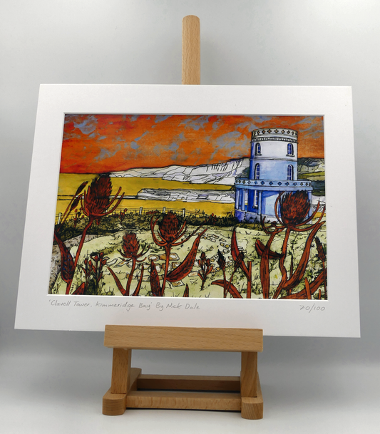 Image of a Medium Art Print featuring a copy of the painting 'Clavell Tower, Kimmeridge Bay' by Nick Dale. The scene depicts Clavell Tower (which is also known as the Clavell Folly or the Kimmeridge Tower) situated on the cliffs overlooking Kimmeridge Bay on the Isle of Purbeck, Dorset. 
The tower; which was built in 1830, is seen in its current position with the original footings visible in the foreground after the tower was moved further back from the cliff in 2006. The print is situated on a small easel.