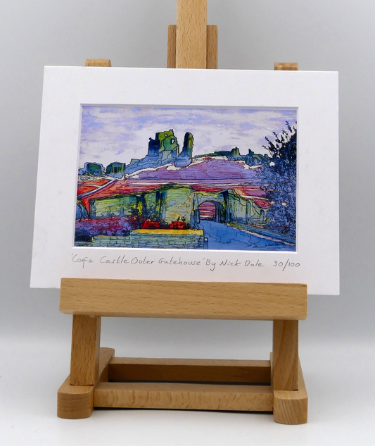 Image of a Small Art Print featuring a copy of the painting 'Corfe Castle Outer Gatehouse' by Nick Dale. The print depicts the slighted outer gatehouse of Corfe Castle in the village of Corfe Castle, Dorset. Beyond it can be seen the castle's south-west gatehouse and keep on top of the central hilltop.  The print is situated on a small easel.