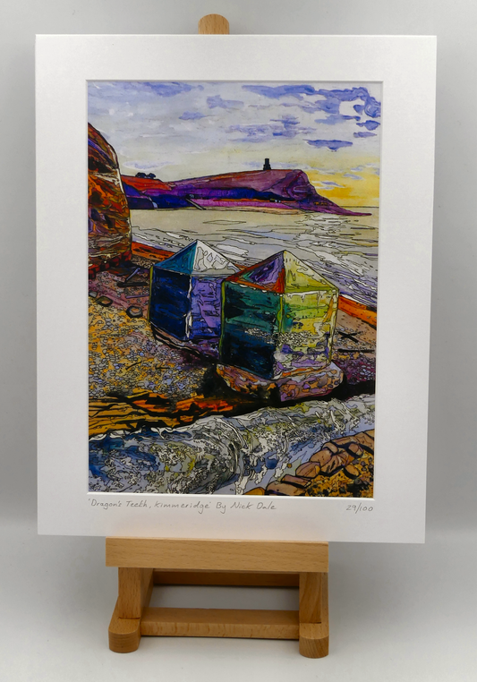 Image of a Medium Art Print featuring a copy of the painting 'Dragon's Teeth, Kimmeridge' by Nick Dale. The scene depicts two surviving dragon's teeth anti-tank defences on the beach at Kimmeridge Bay, Dorset. Beyond them can be seen Clavell Tower on the cliff top. The Gaulter Gap forms a relatively easy route off the beach to the cliffs above for any invading force so it was blocked with dragon's teeth and a concrete pillbox during World War II. The print is situated on a small easel.