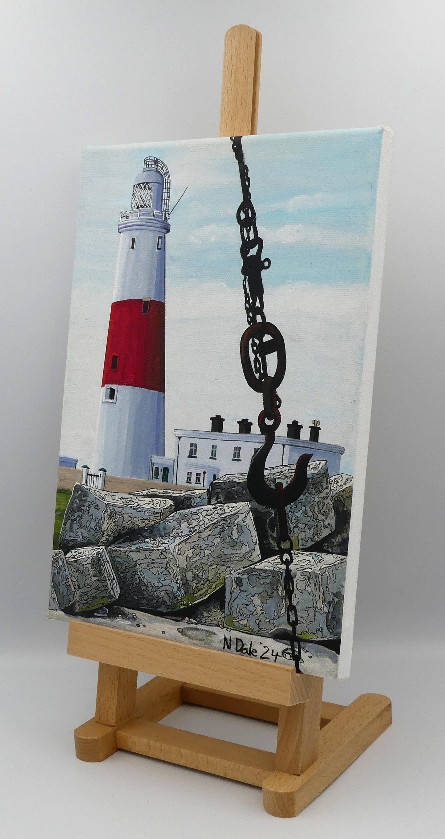Image of the original painting 'Portland Bill Lighthouse And The Red Crane Hook' by Nick Dale. The painting depicts a close up detail of the hook of the Red Crane at Portland Bill, Dorset with the Portland Bill Lighthouse standing beyond it, behind a pile of quarried stone.