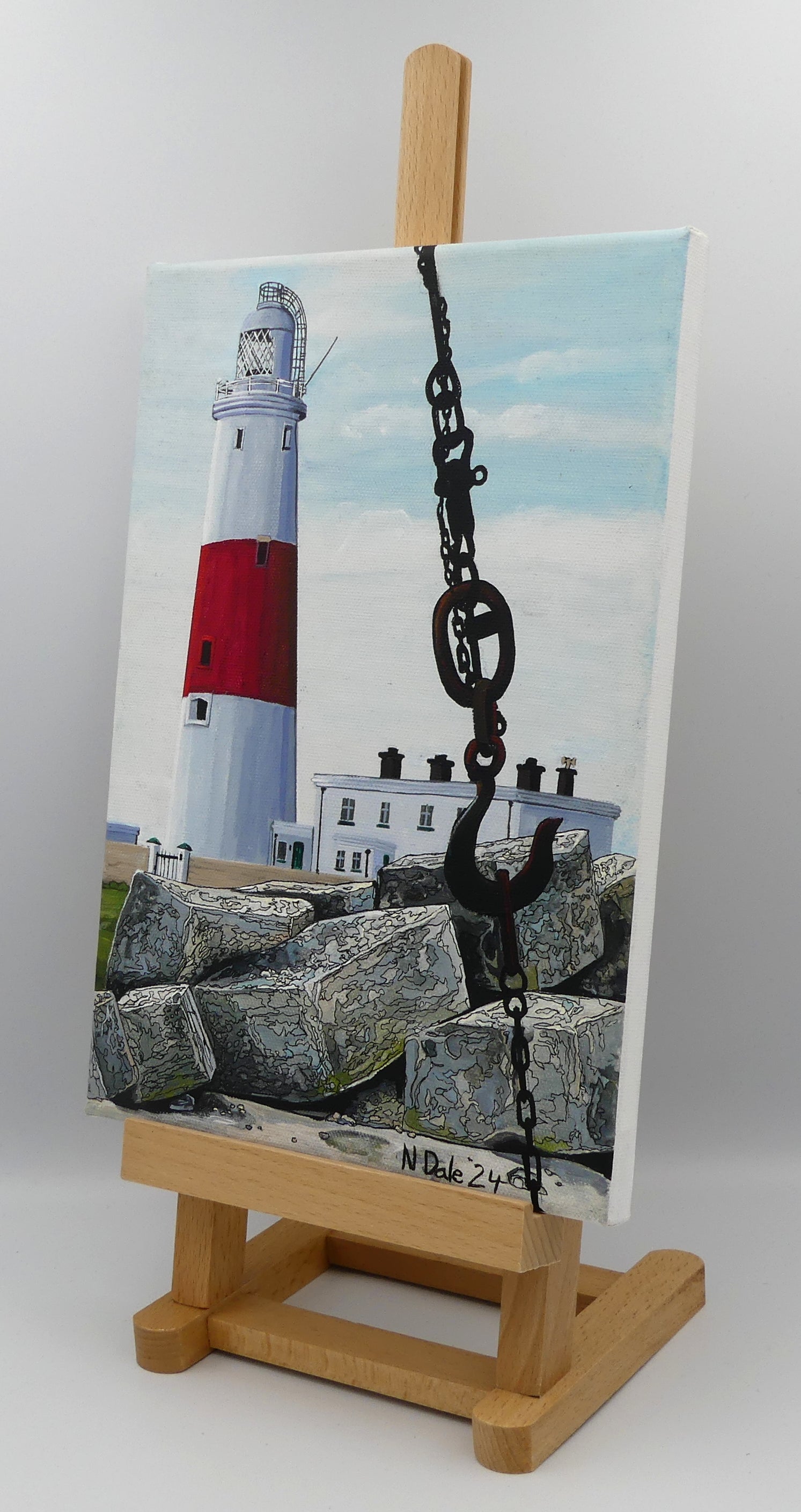 Image of the original painting 'Portland Bill Lighthouse And The Red Crane Hook' by Nick Dale. The painting depicts a close up detail of the hook of the Red Crane at Portland Bill, Dorset with the Portland Bill Lighthouse standing beyond it, behind a pile of quarried stone.