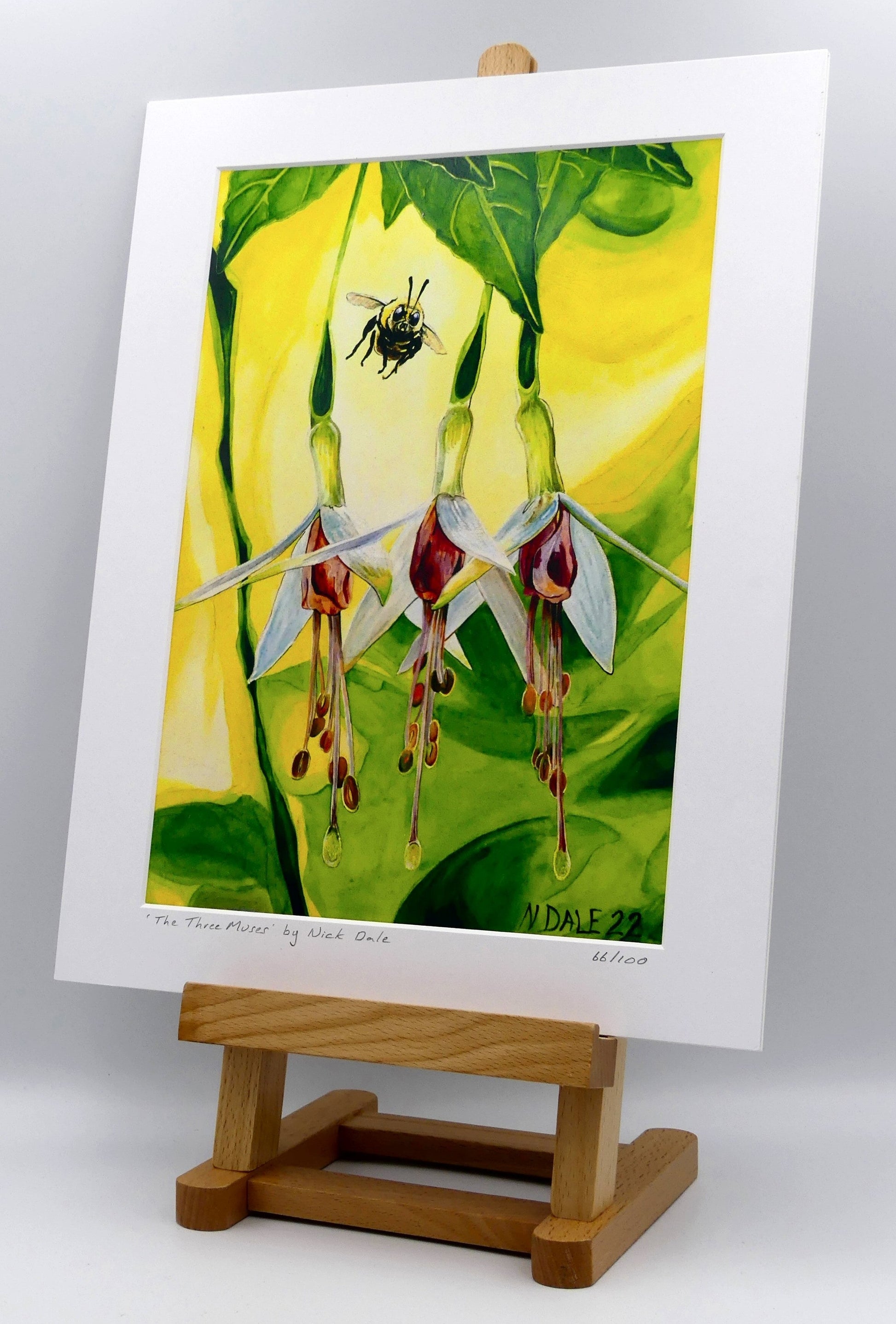 Image of a Medium Art Print featuring a copy of the painting 'The Three Muses' by Nick Dale. The print depicts a close-up view of a bee approaching its prize. But which will it choose? The print is situated on a small easel.