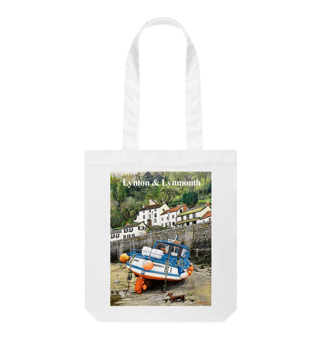 Image of a White Tote Bag featuring a copy of the painting 'Lynmouth At Lowest Tide' by Nick Dale, with the words 'Lynton & Lynmouth' written across the top. The bag depicts an unusual perspective on the picturesque harbour of Lynmouth (Devon), as seen from the floor of the harbour at low tide. Behind the fishing boat can be seen the characterful harbourside buildings.