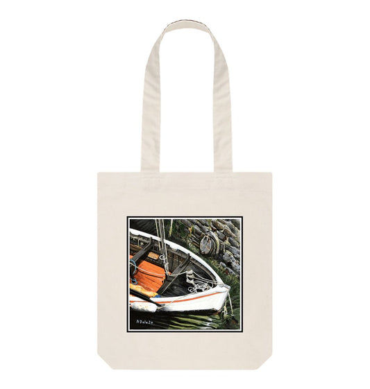 Image of a Natural Tote Bag featuring a copy of the painting 'The Outlet' by Nick Dale. The bag depicts a view down into the harbour at Lynmouth in North Devon showing a small sailing boat at rest against the harbour wall next to a water outfall pipe.