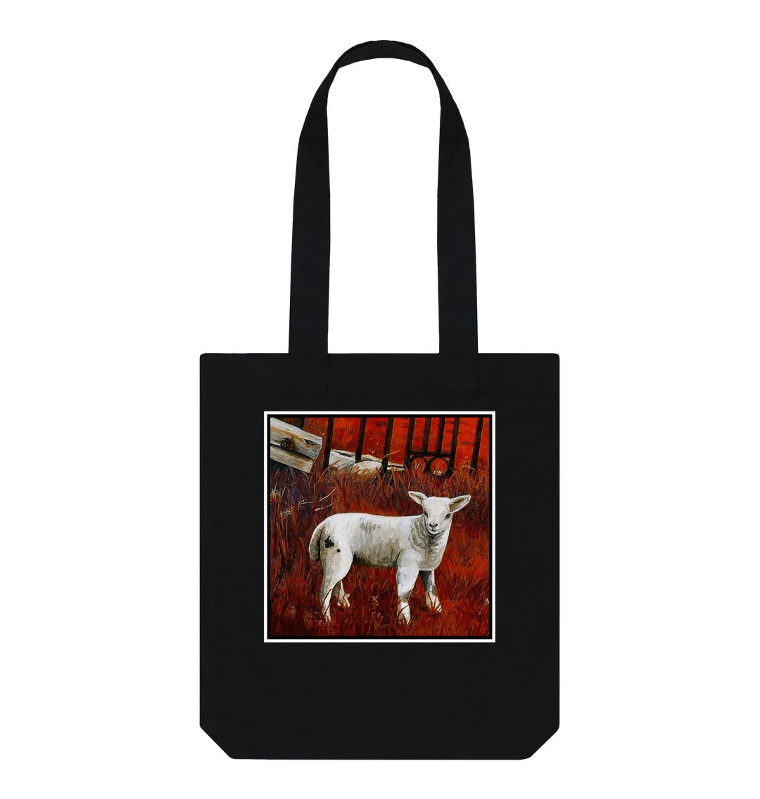 Image of a Black Tote Bag featuring a modified copy of a detail from the painting 'The Gate' by Nick Dale. The bag depicts a lamb in front of an ornamental garden gate reused by a farmer somewhere in North Devon, probably to the south of Valley of Rocks, Lynton. The lamb was observed on Lundy Island, Devon.