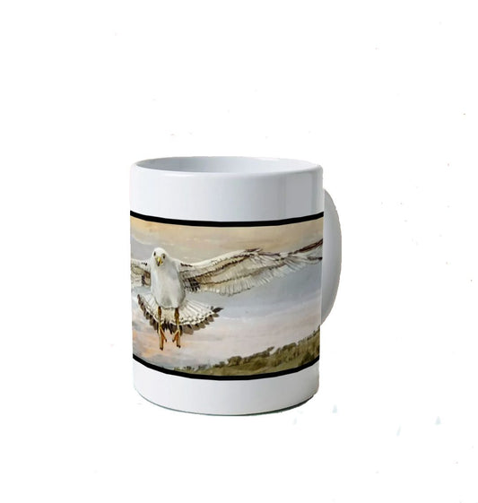 Image of a White Mug featuring a copy of a detail from the painting 'The Gordian Knot At Lyme Regis' by Nick Dale. The mug depicts a gull flying over the Cobb at Lyme Regis, Dorset. The title refers to the jumbled pile of fishing equipment sitting on the quayside visible in the original painting.