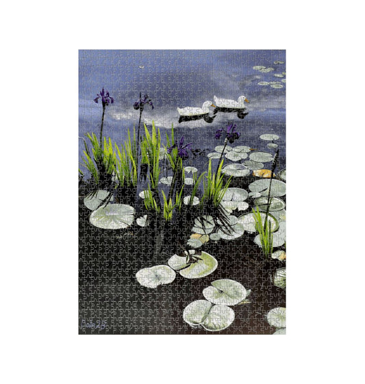Image of a 1000 Piece Jigsaw Puzzle featuring a copy of the painting 'Dark Waters' by Nick Dale. The jigsaw depicts lily pads, irises and ducks on a pond at Knightshayes Court, Devon.