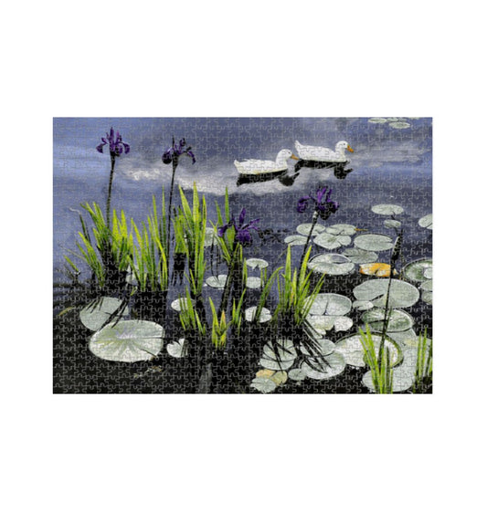 Image of a 1000 Piece Jigsaw Puzzle featuring a copy of the painting 'Dark Waters' by Nick Dale. The jigsaw depicts lily pads, irises and ducks on a pond at Knightshayes Court, Devon.