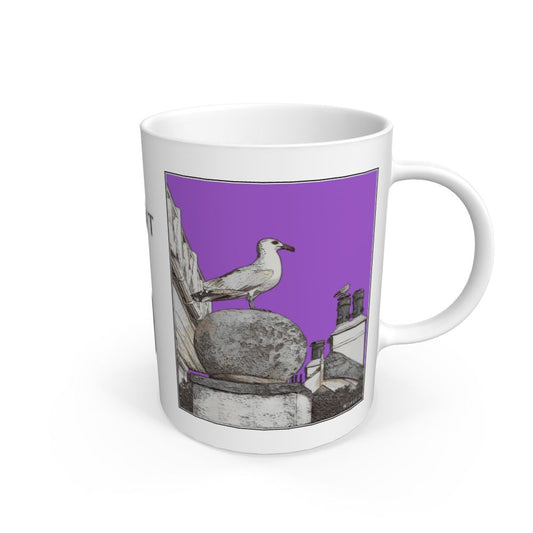 Image of a White Mug featuring a modified copy of the painting 'A View Of The Sea At Lyme Regis' by Nick Dale - this being the 'Purple' version. The mug depicts a gull and buildings along Marine Parade, Lyme Regis.