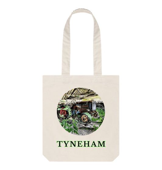 Image of a Natural Tote Bag featuring a copy of the painting 'A Well Deserved Rest At Tyneham' by Nick Dale. The bag depicts a Fordson Major tractor laid up in a farm building at the abandoned village of Tyneham in Dorset.