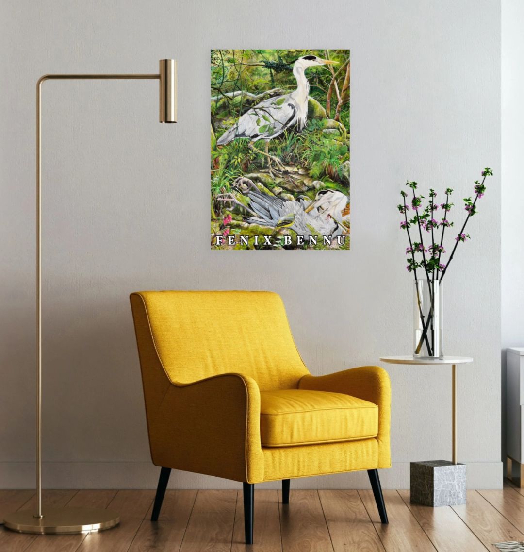 Image of a Large Art Print (A3 size) featuring a copy of the painting 'Fenix Bennu' by Nick Dale with the words 'FENIX BENNU' written across the bottom. As displayed on a wall next to a chair. The print depicts 2 grey herons (1 living & 1 dead) & is named after the Egyptian god Bennu; which may be the origins of the phoenix legend. 'Fenix' is Anglo-Saxon for phoenix. The blood of the dead heron is smoking where it drips on the ground; suggesting that this is indeed a phoenix.