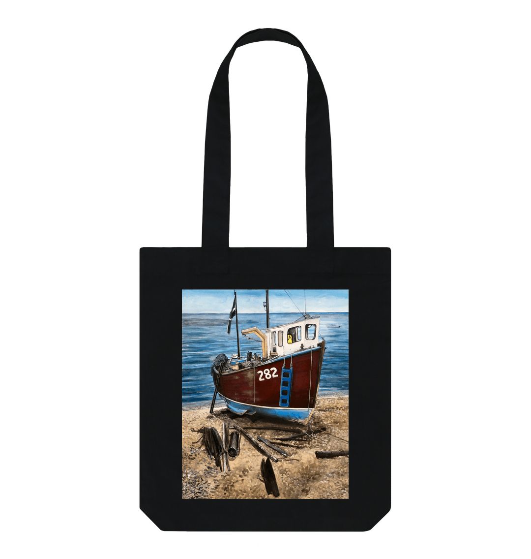 Image of a Black Tote Bag featuring a copy of the painting 'Relaxing Beer' by Nick Dale. The bag depicts a fishing boat beached at Beer, Devon. The wood is laid under the boats to aid in their winching up the shingle beach.