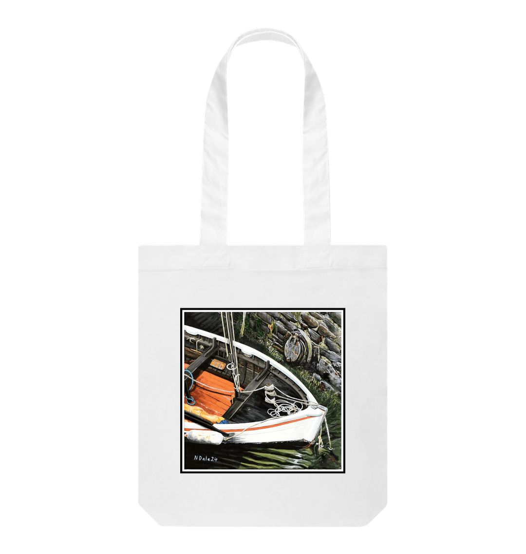 Image of a White Tote Bag featuring a copy of the painting 'The Outlet' by Nick Dale. The bag depicts a view down into the harbour at Lynmouth in North Devon showing a small sailing boat at rest against the harbour wall next to a water outfall pipe.