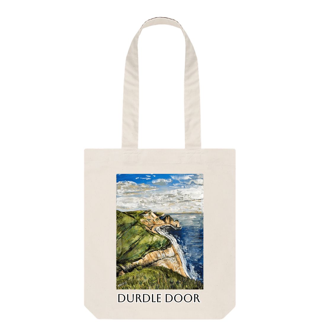Image of a Natural Tote Bag featuring a copy of the painting 'Durdle Door From The West' by Nick Dale with the words 'Durdle Door' written below it. The bag depicts a view along the Jurassic Coast to the famous Dorset limestone arch landmark, as seen from the coastal path to the west.