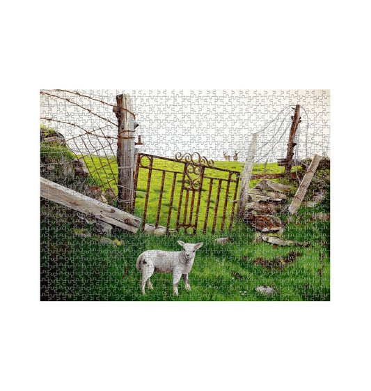 Image of a 1000 Piece Jigsaw Puzzle featuring a copy of the painting 'The Gate' by Nick Dale. The jigsaw depicts a lamb in front of an ornamental garden gate reused by a farmer somewhere in North Devon, probably to the south of Valley of Rocks, Lynton. The lamb was observed on Lundy Island, Devon.