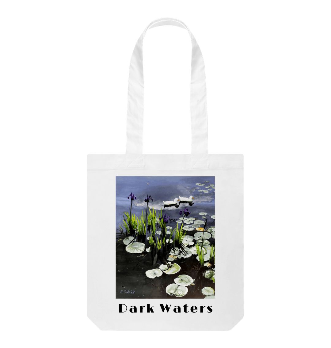 Image of a White Tote Bag featuring a copy of the painting 'Dark Waters' by Nick Dale, with the words 'Dark Waters' written beneath it. The bag depicts lily pads, irises and ducks on a pond at Knightshayes Court, Devon.